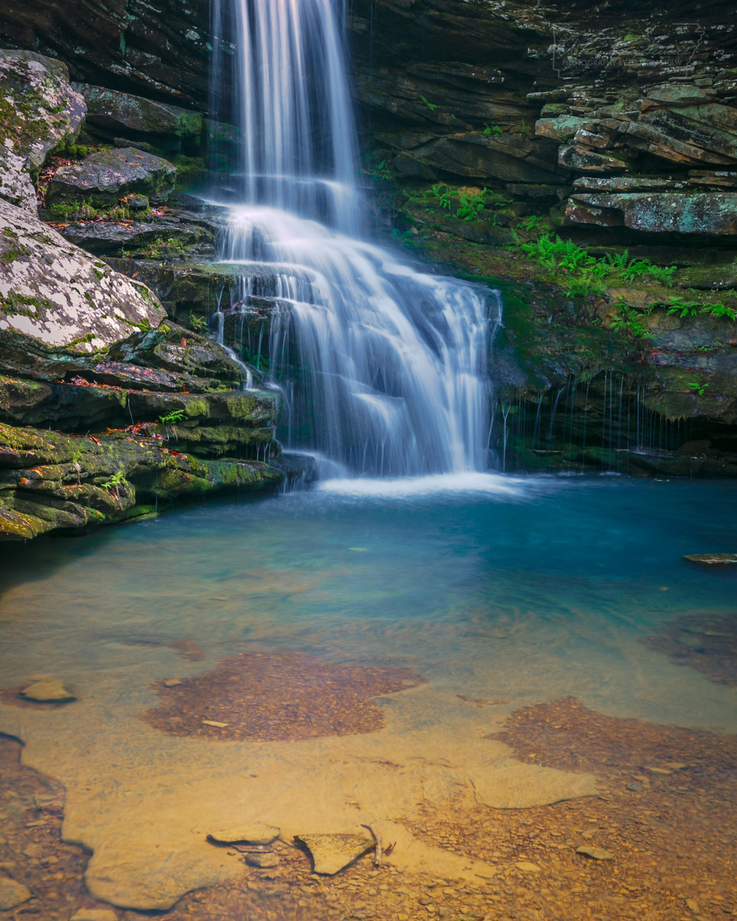 A clear, blue pool at the base of Magnolia Falls in the Upper Buffalo Wilderness Area.
