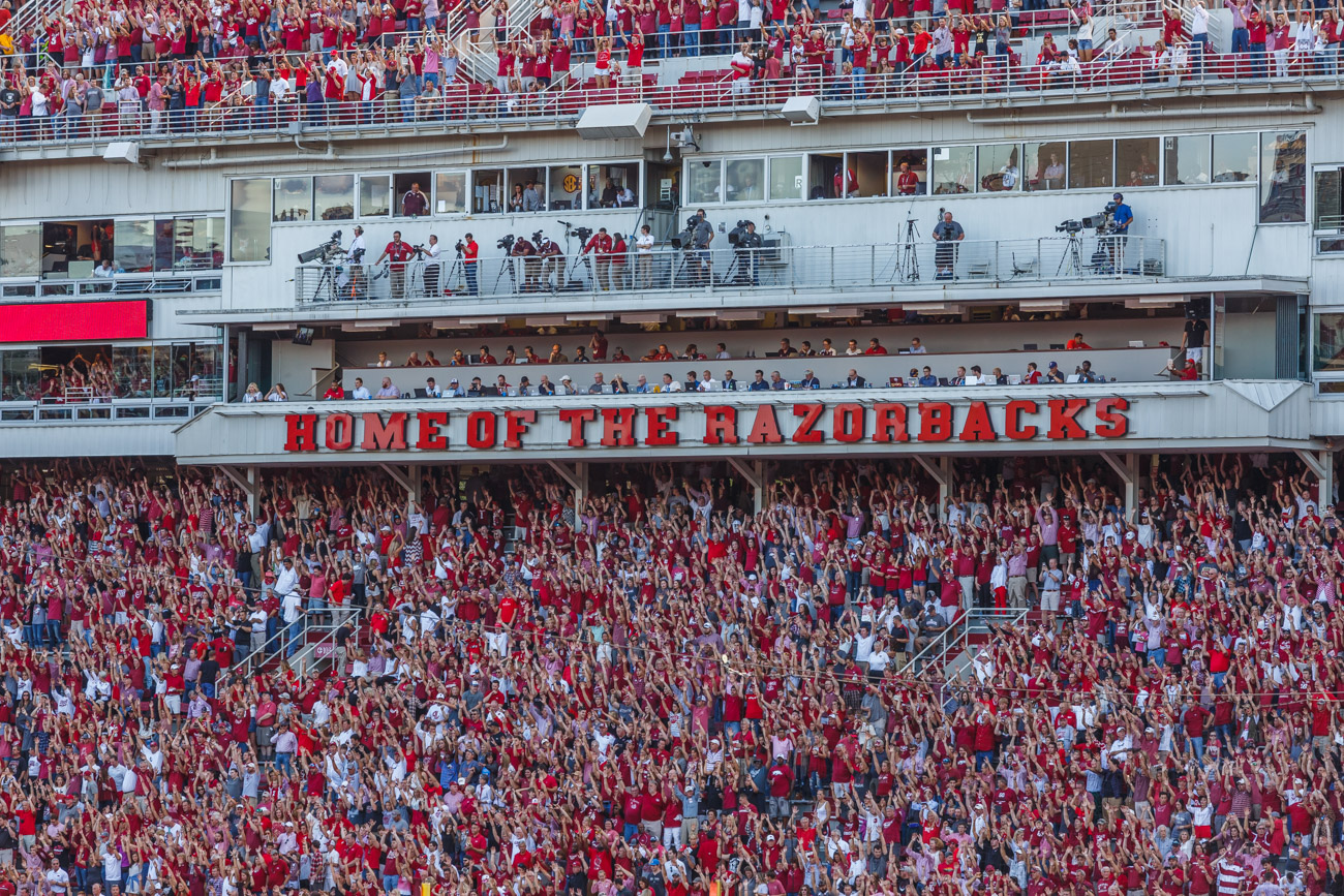 Fans are "Calling The Hogs" at Razorback Stadium.